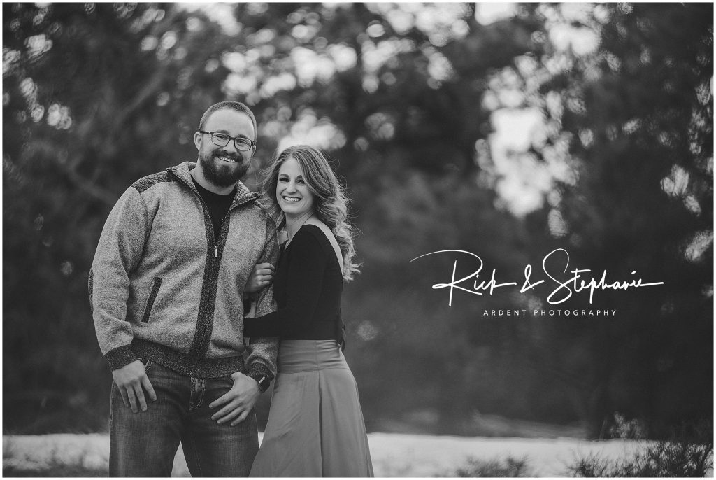 Black and white photo of an engaged couple. This photo was taken in between Laramie and Cheyenne for their engagement photos.