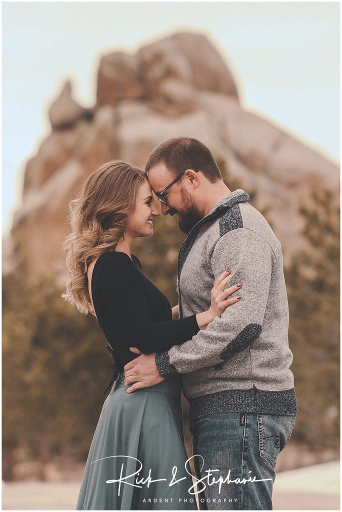 Happy engagement couple in front of Vedauwoo. Photographed during a Cheyenne Wyoming engagement session.