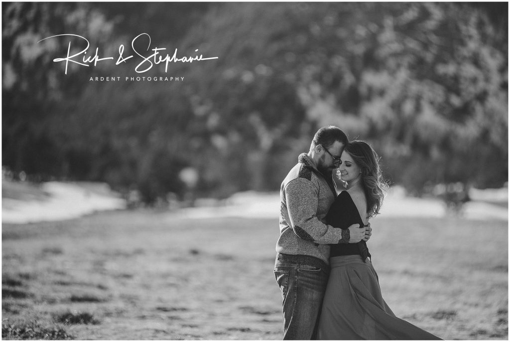 Wild windblown formal portrait of an engaged couple. Photographed in natural areas in between Laramie WY and Cheyenne WY.