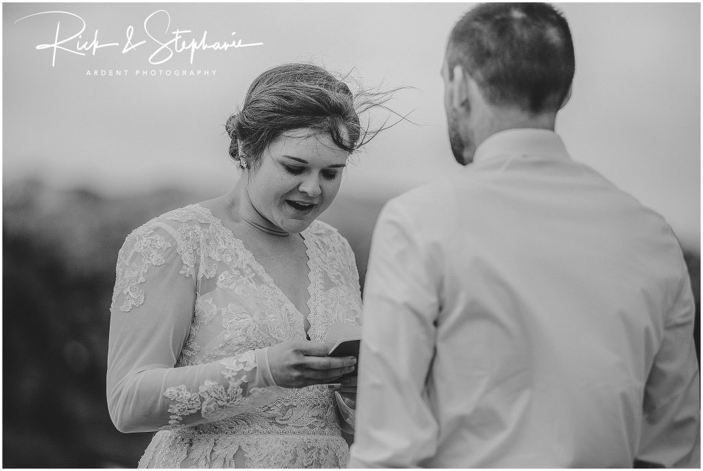 Bride reading her vows to her groom during their Vedauwoo elopement in Wyoming.
