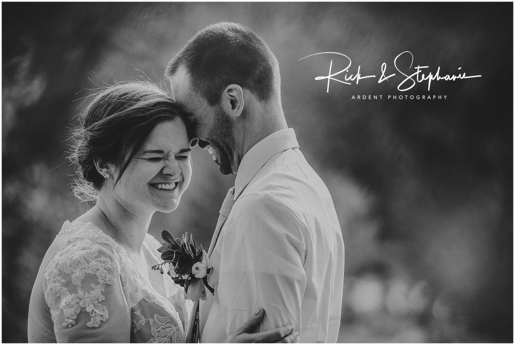 Couple laughs together during their Laramie, WY wedding in Vedauwoo.