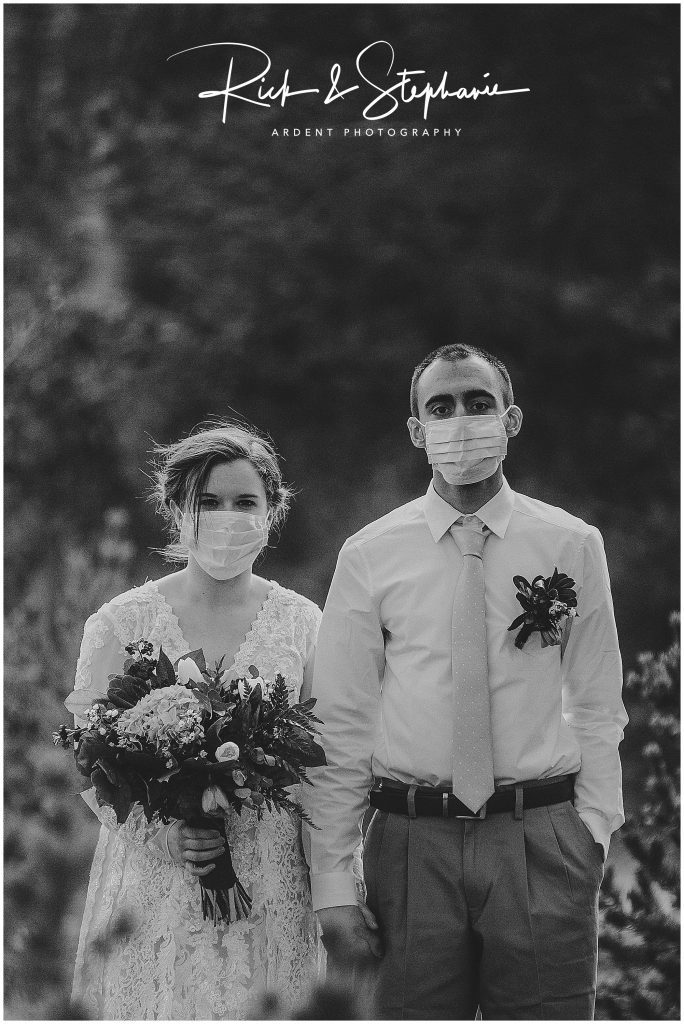 Couple whose wedding occurred during the corona virus pandemic. Wearing masks during their elopement is such a keepsake reminder of this time.