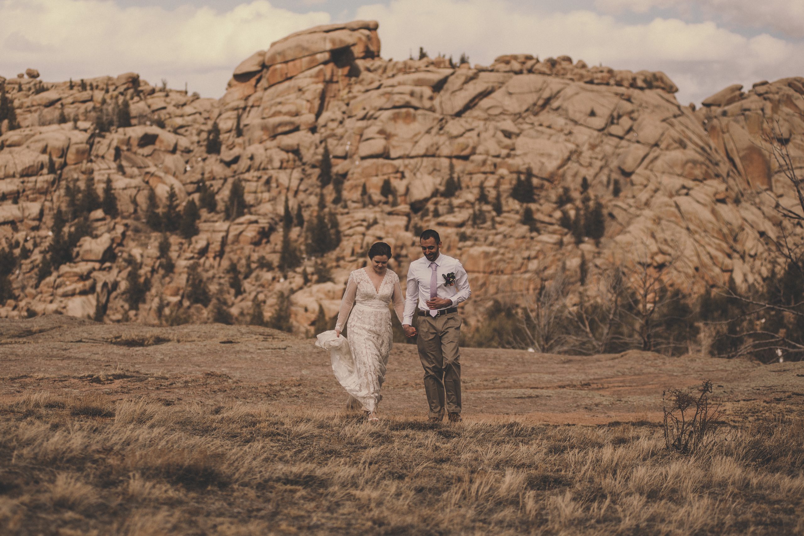Couple walking outdoors during their Vedauwoo elopement outside of Cheyenne, WY