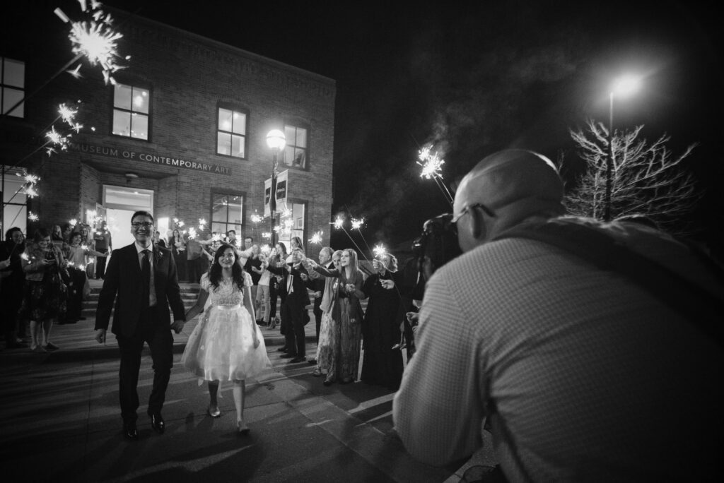 photo of a wedding photographer behind the scenes on the wedding day